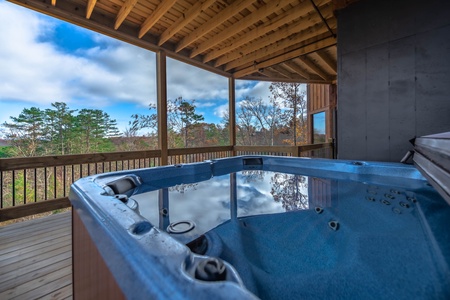 The Ridgeline Retreat- Hot tub on the deck with mountain views
