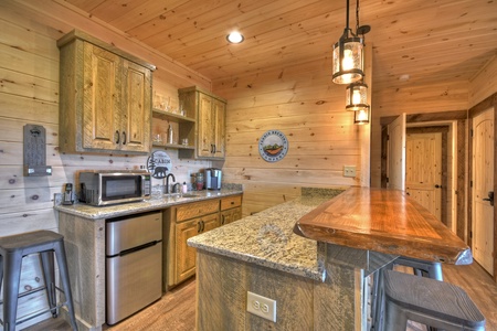 A Perfect Day- Lower level wet bar with appliances and bar stool seating