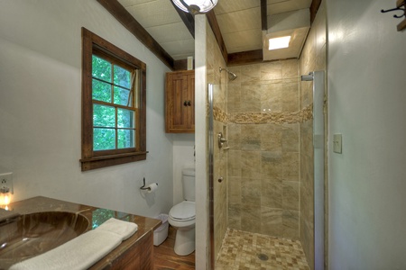 JME Retreat- Full bathroom with a walk in shower