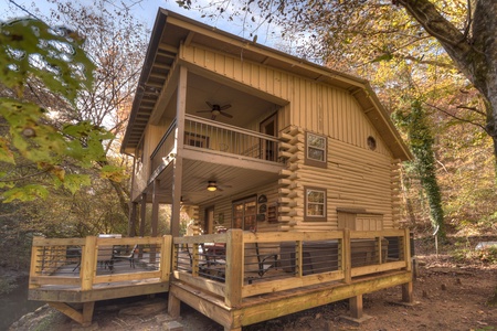 Happy Trout Hideaway- Exterior side view of the cabin with back deck