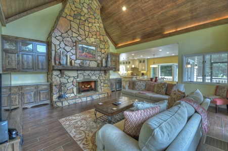 Jump Right In- Living room area with a large fireplace and seating