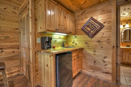 Aska Lodge- Lower level wet bar with rustic cabinets and coffee station