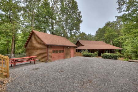 Falling Leaf- Side view with the garage access and driveway to the cabin