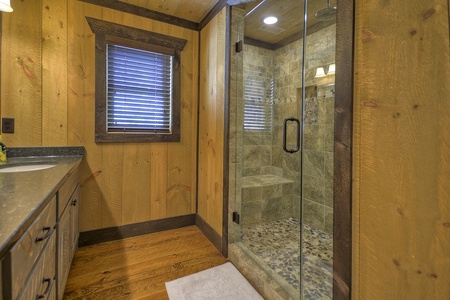 Vista Rustica- Master bathroom with a walk in stone shower