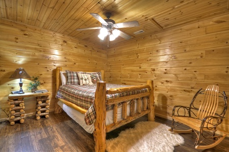 Grand Mountain Lodge- Lower level queen bedroom with rustic furniture