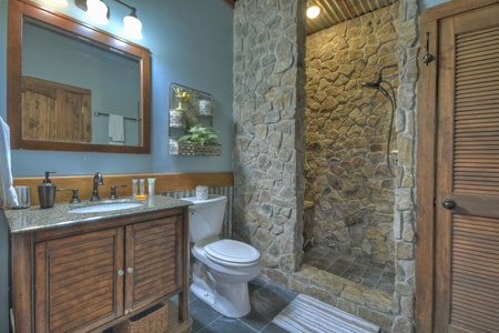 River Lodge- Lower level bathroom with a stone shower