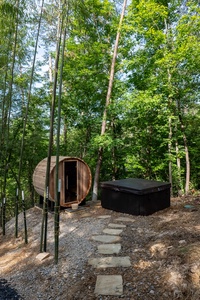 Hot tub and Sauna nested in the woods