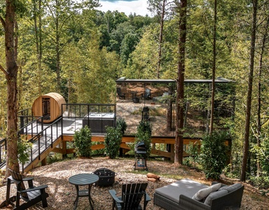 Fire pit, sauna, hot tub, mirror house, trees