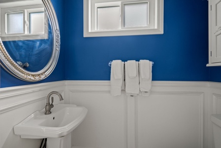 Powder bath between kitchen and dining