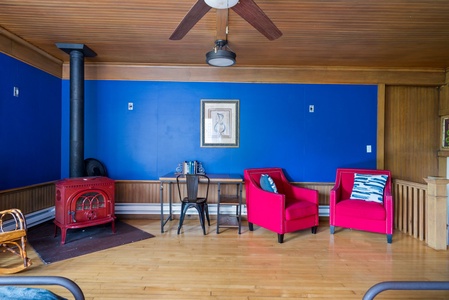 Blue Room features faux wood stove and desk for workspace