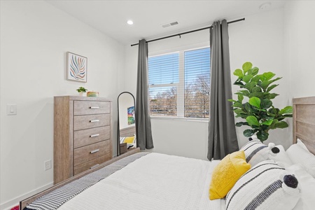 Vibrant Minimalist Bedroom with Dresser