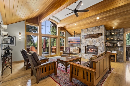 Main Floor Living room with a large stone fireplace