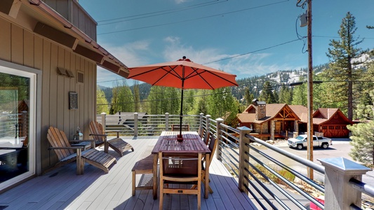 Outdoor seating with umbrella at this squaw valley rental: Eagle's Nest Lodge