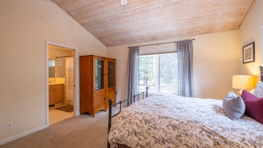 Master Bedroom into Master Bathroom: Three Pines Family Cabin