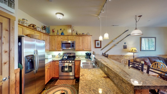 Kitchen with countertops~ oven and fridge: Truckee Cinnabar Vacation Retreat