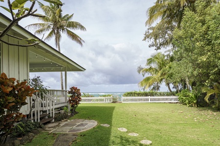 Tropical cottage with lush landscaping and ocean access just steps from your door.