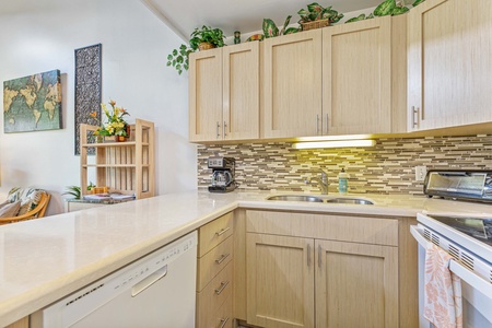 Step into your fully equipped kitchen with warm wood cabinets, granite counters, and gleaming appliances ready for your culinary adventures.
