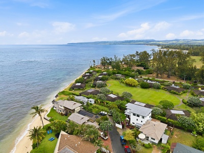 Beachfront community nestled along tranquil shores, surrounded by lush tropical gardens and scenic coastal landscapes. The property features private beach access and stunning ocean views.