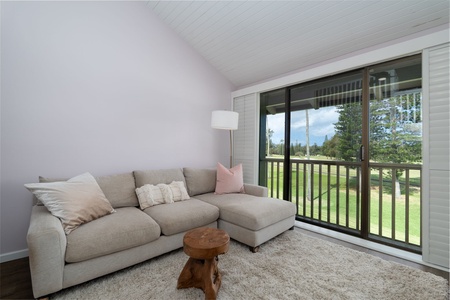 Relax into your private retreat with lush green views framing the balcony. Sink into the plush sofa, sip your morning coffee, and let the peaceful scenery outside become your everyday escape.