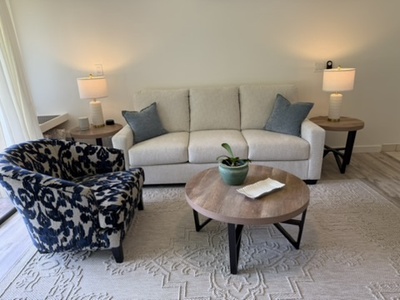 Sink into the inviting sofa and armchair, where soft lighting and thoughtful details create your perfect space to unwind with a book or simply enjoy the quiet.