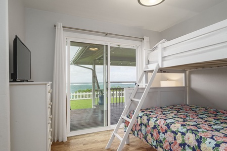 Drift off to sleep with ocean waves as your soundtrack in this cozy bunk room overlooking endless blue waters.