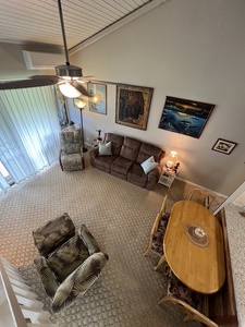 Settle into your spacious living room with vaulted ceilings, cozy seating, and plenty of natural light—perfect for unwinding after a day of exploring.