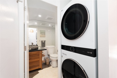 Your own stacked washer and dryer make packing light a breeze, while the adjacent bathroom keeps everything you need close at hand.