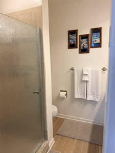Step into your private bathroom, where fresh towels and a walk-in shower await you after a day of adventure.