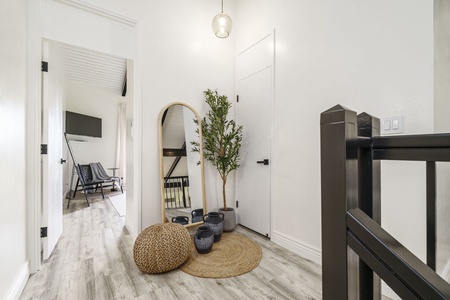 Your stylish entryway welcomes you with warm natural textures, soft lighting, and thoughtful design details that set the tone for relaxation.