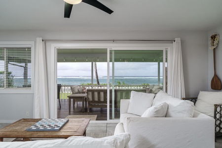 Relax on plush white sofas while ocean breezes flow through sliding doors to your private oceanfront terrace.