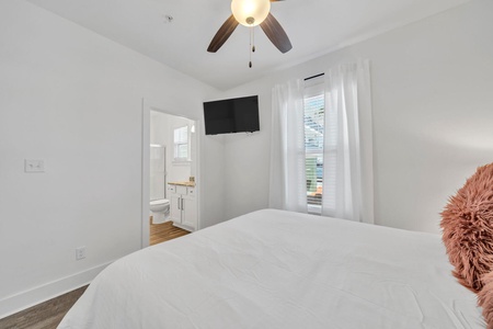 The master bedroom features a queen size bed and private bathroom!