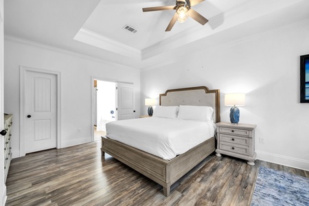 The master bedroom features a king size bed and a sofa for lounging (sofa sleeper not included).