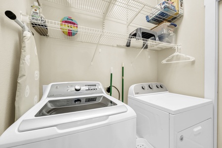 Your in-unit laundry space makes it easy to keep clothes fresh during your stay, with organized shelving and hangers for convenience.