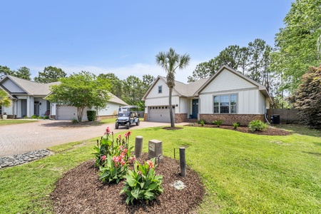 A welcoming vacation home nestled in a peaceful, tree-lined neighborhood, offering privacy and charm.