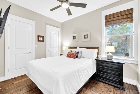 Sink into crisp white linens and wake to natural light filtering through your private bedroom window.