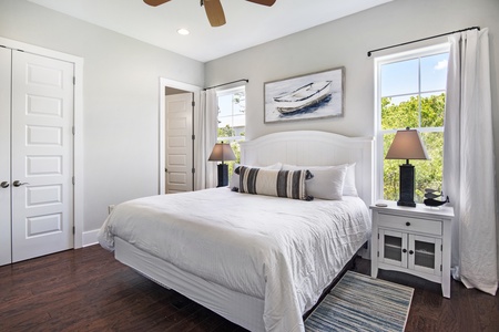 The master bedroom features a king-size bed and private bathroom!