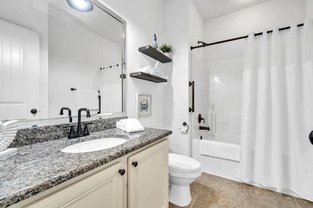 The guest bathroom is a full-bath with tub-shower combo, just outside both guest room doors!