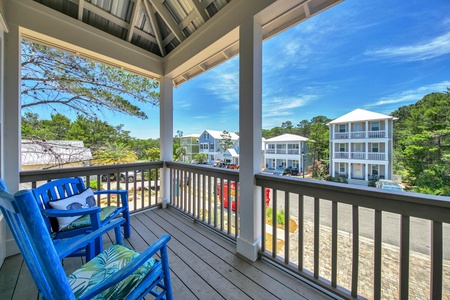 A shaded balcony and porch offer a wonderful place to soak up the beach breeze!