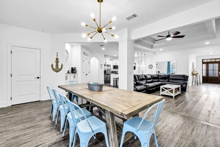 Gather around your spacious dining table where coastal charm meets modern comfort, perfect for memorable meals with loved ones.