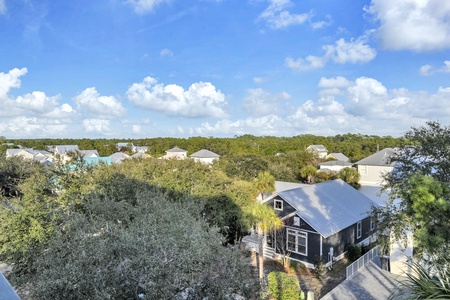 A charming coastal community nestled among lush greenery and mature trees, offering a peaceful retreat setting.