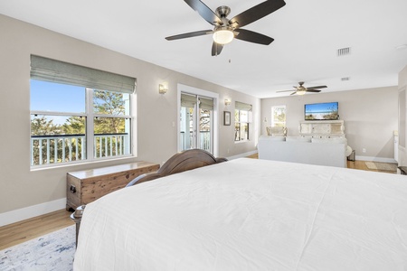 Drift into peaceful sleep surrounded by natural light and gentle breezes from your private balcony overlooking serene treetops.