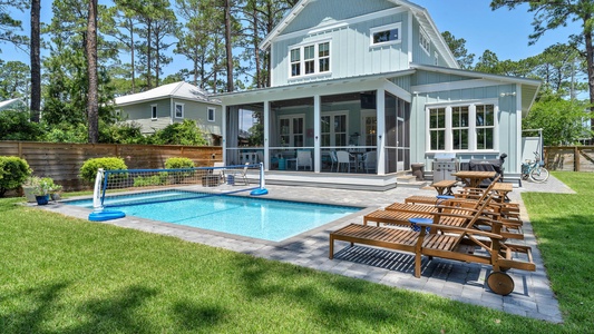 Soak up the sun on teak loungers at the pool deck!