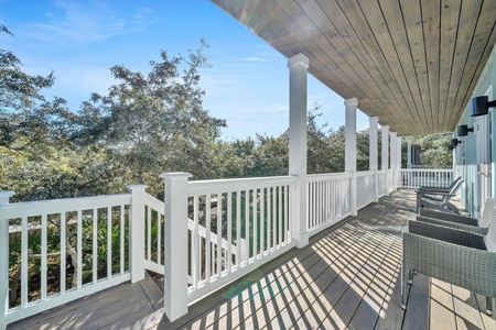 Steps lead from the back porch to a short walking path to the pool!