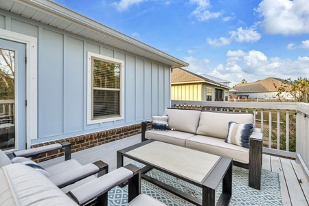 Your private deck offers plush seating with soft cushions where you can unwind under the open sky and soak in peaceful neighborhood views.
