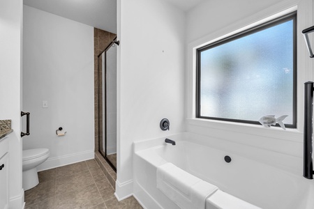 The master bathroom includes dual-vanities, a soaking tub, and a walk-in shower!
