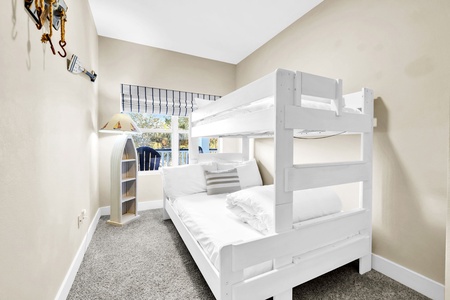 Your family will love this cozy bunk bed room on the 2nd floor, complete with built-in storage and playful nautical touches for memorable bedtimes.
