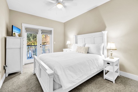 A second queen bedroom on the 2nd floor, with French doors opening to the balcony.