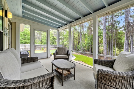 Unwind in your screened porch with plush seating, tranquil forest views, and gentle breezes—your perfect spot for morning coffee or evening relaxation.