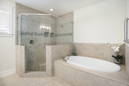 The master bathroom is expansive with walk-in shower, soaking tub, and walk-in closet!