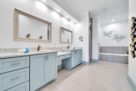 The master bathroom with dual vanities, walk-in shower, soaking tub and more!